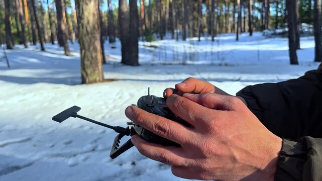 Piloting a Drone in a Snowy Pine Forest