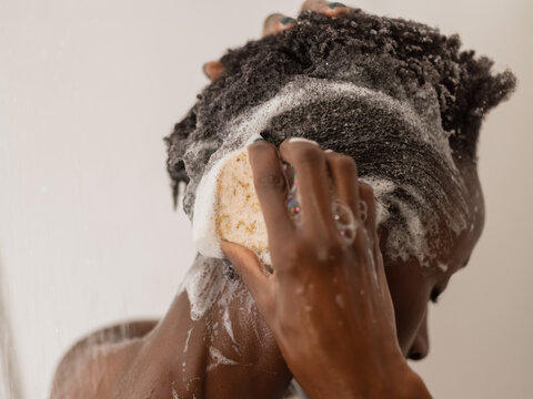 Woman rubbing hair with shampoo bar 