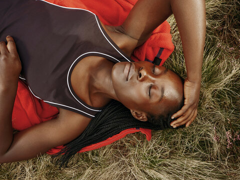 Black Woman Hiking in Red Fleece in Autumn Field