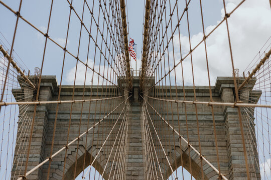 Cables and Towers of Brooklyn Bridge with American Flag