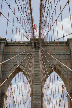 Cables and Towers of Brooklyn Bridge with American Flag