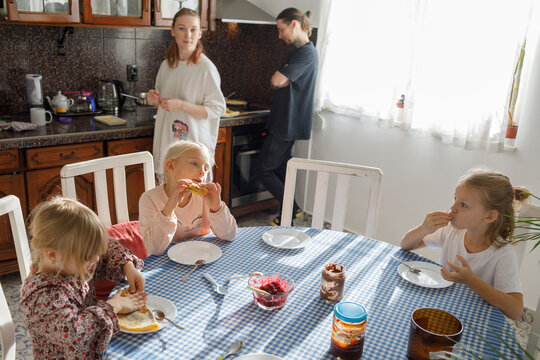 Family enjoys pancakes in the morning