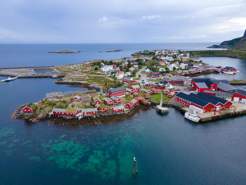 fjord in Lofoten islands aerial view with red houses, Norway