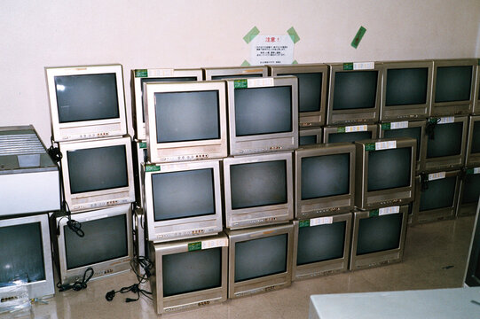 A stack of televisions in a room