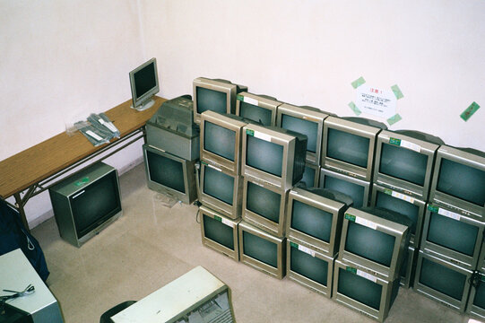 A stack of televisions in a room