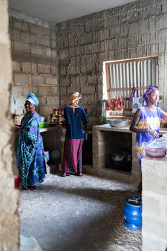 Senegalese women preparing food in traditional kitchen