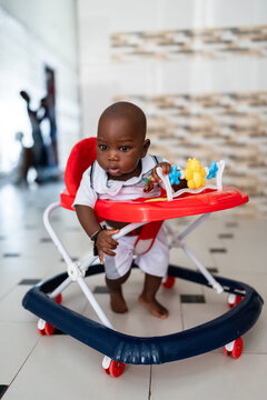 African baby boy learning to walk in Senegal