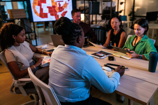 Diverse team collaborates in a modern office setting.