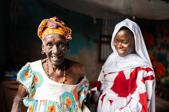 Smiling women representing tradition and community in Senegal