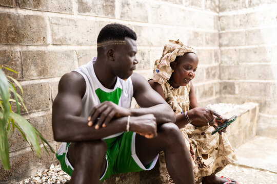 African mother and son bonding with technology
