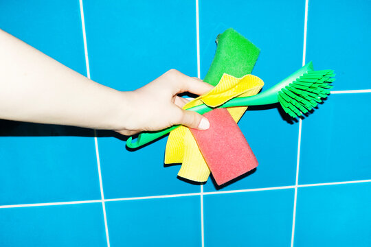 Modern cleaning equipment in front of tile wall with hard flashlight