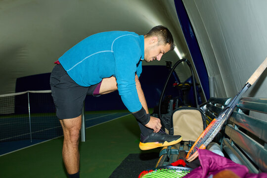 Tennis player gets ready for the match