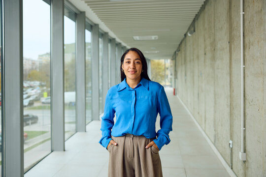 Businesswoman poses in the hallway