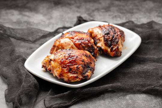 delicious grilled chicken thigh on plate