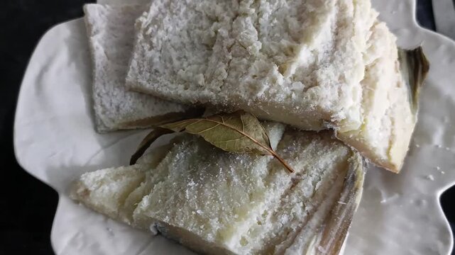 dry cod fish on white plate
