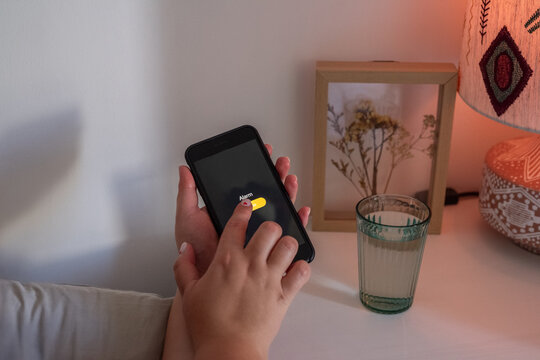 Woman turning off alarm 