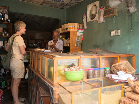 Tourist Interacts With Shopkeeper in small Spice Shop in Sri Lanka