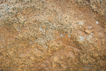 Rough stone surface texture close up.