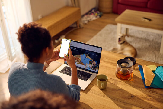 Woman works from home, using technical gadgets