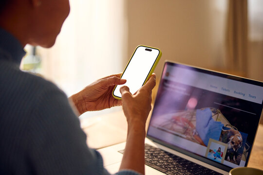 Woman works from home, using technical gadgets