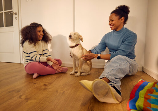 Mom and daughter spend time with the dog