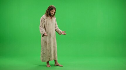Naklejka premium Jesus Christ with open hands on chroma key background. Religious prophet in period attire. Biblical figure for Easter holiday and Christian studies.