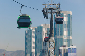 Busan Air Cruise, Busan cable car, ride on multicoloured sky capsule gondola route, with Songdo beach and Skywalk and Busan Bay panorama, South Korea, Songdo Station in a spring sunny day © tsuguliev