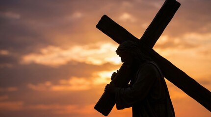 Naklejka premium Jesus Christ carrying the cross in silhouette against a dramatic sunset background. Christian faith and Easter holy week concept.