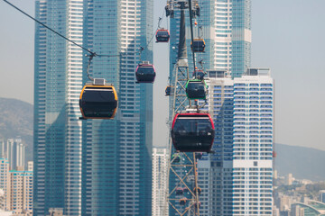 Busan Air Cruise, Busan cable car, ride on multicoloured sky capsule gondola route, with Songdo beach and Skywalk and Busan Bay panorama, South Korea, Songdo Station in a spring sunny day © tsuguliev