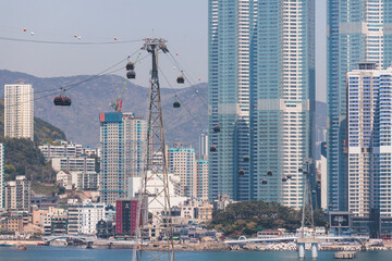 Busan Air Cruise, Busan cable car, ride on multicoloured sky capsule gondola route, with Songdo beach and Skywalk and Busan Bay panorama, South Korea, Songdo Station in a spring sunny day © tsuguliev