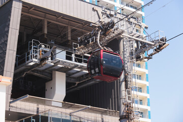 Busan Air Cruise, Busan cable car, ride on multicoloured sky capsule gondola route, with Songdo beach and Skywalk and Busan Bay panorama, South Korea, Songdo Station in a spring sunny day © tsuguliev