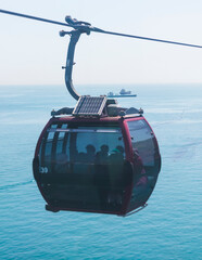 Busan Air Cruise, Busan cable car, ride on multicoloured sky capsule gondola route, with Songdo beach and Skywalk and Busan Bay panorama, South Korea, Songdo Station in a spring sunny day © tsuguliev