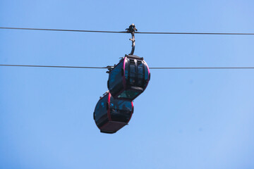 Busan Air Cruise, Busan cable car, ride on multicoloured sky capsule gondola route, with Songdo beach and Skywalk and Busan Bay panorama, South Korea, Songdo Station in a spring sunny day © tsuguliev