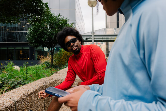 Athletes using their smartphones to monitor their physical activity