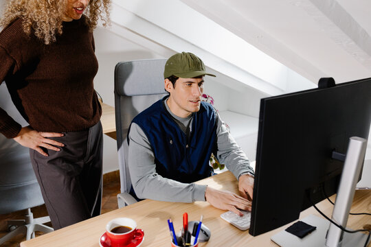 Self-employed man focused on feedback from a teammate