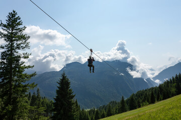 Mountain zip line, high altitude cables, outdoor adventure activity, extreme sport, open air leisure, adrenaline experience © Travel Studio Stock