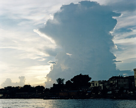 The coastal city and the landscape with large clouds