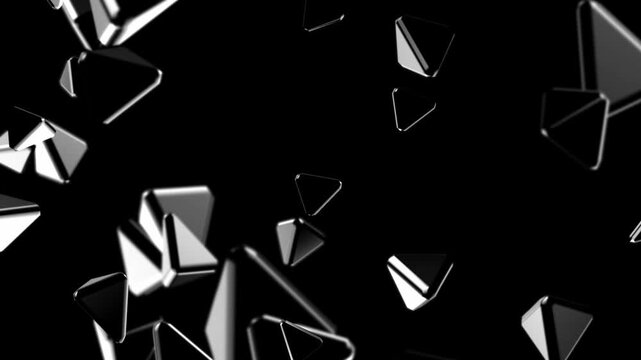 Detailed view of glossy metallic triangular polygons floating in black space creating a sharp modern abstract background with strong contrast and depth