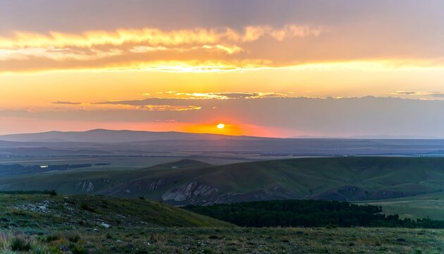 Sunset over rolling hills and landscape.