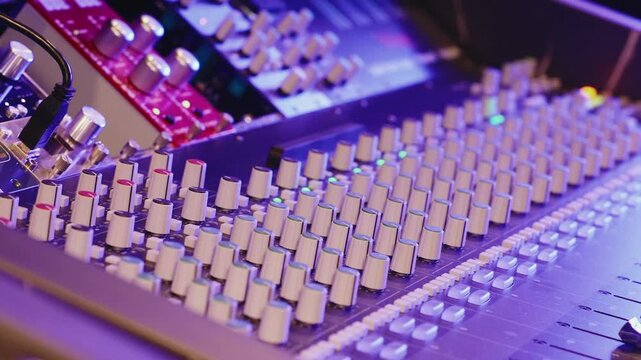 Studio Mixing Console Displays Numerous Knobs And Sliders. Audio Equipment, Music Production, Recording Technology, Creative Industry.