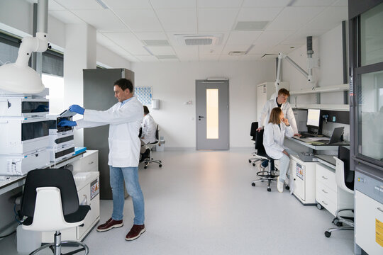 Scientists Work in Modern Laboratory on Research Projects