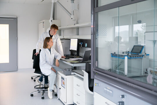 Scientists Work Together in a Modern Laboratory Setting