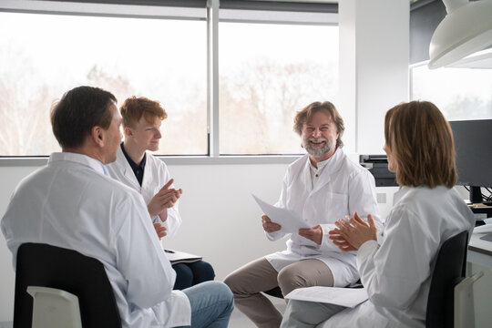 Scientists Discussing Research Findings in a Lab Setting