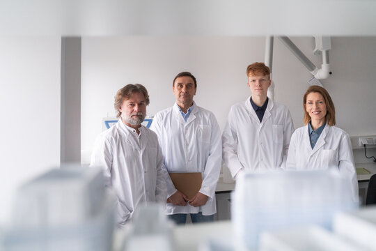 Lab Workers Standing Together in a Research Facility