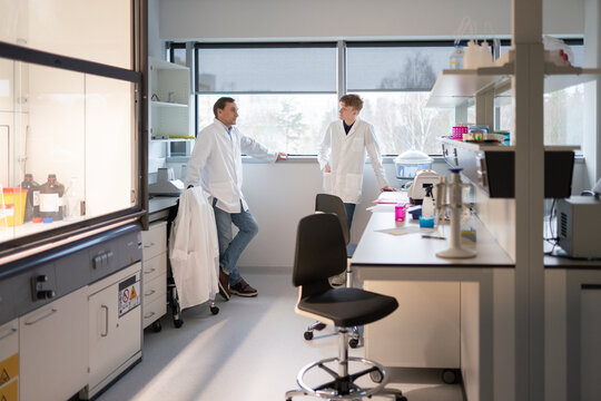 Scientists Discussing Research in a Laboratory 