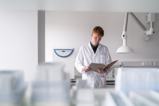 Scientist Studies Data in a Laboratory Setting 