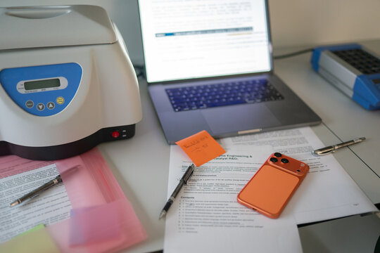 Workspace With Documents and Phone on a Desk 