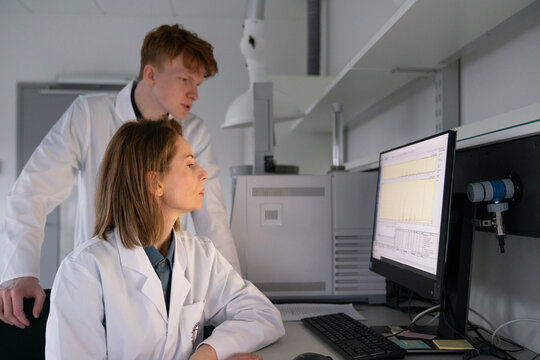 Scientists Analyze Data in a Laboratory Setting