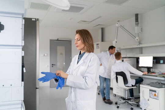 Scientists Work in Modern Laboratory