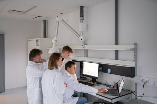 Research Team Works Together in Lab on Important Project